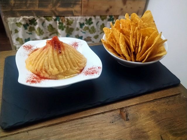 Hummus with corn nachos For sharing or snacking Takeaway food