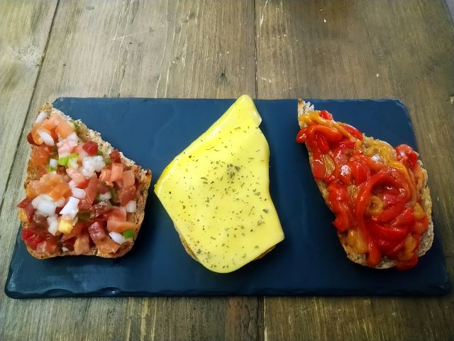 Assorted toasts: with roasted peppers, pipirrana, cheese and basil For sharing or snacking Takeaway food